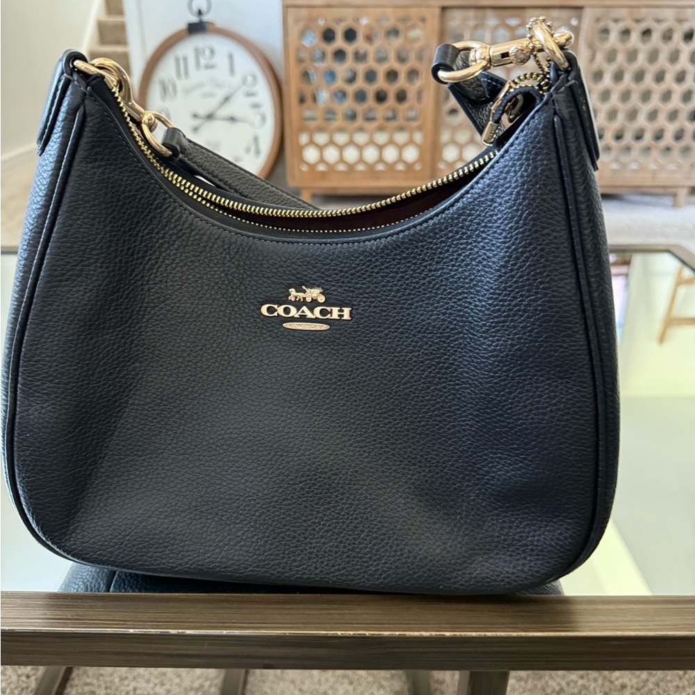 Black Leather Coach Shoulder Bag with Gold Accents